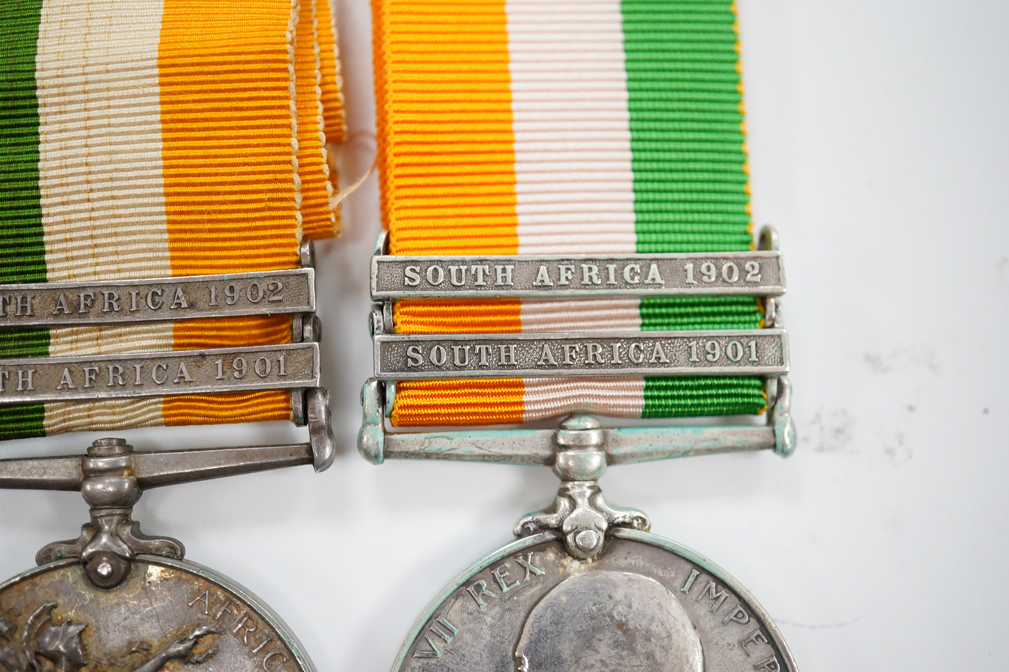 A Queen's South Africa Medal with Laings Nek, Belfast and OFS clasps to 12036 Bomr M.Miller R.F.A.Arty, another unnamed with 1901, 1902 and CC clasps, and two King's South Africa medals both with 1901/1902 clasps to 6408